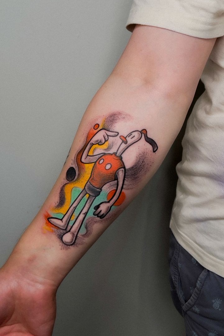 Color cartoon character tattoo on forearm
