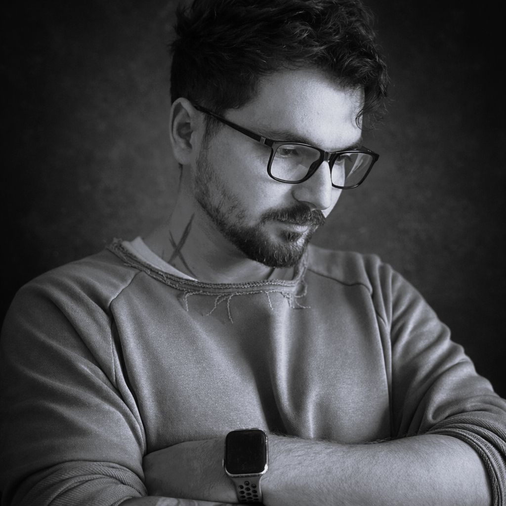Portrait of Nikolay Ginzburg, tattoo artist behind Gini Tattoo
